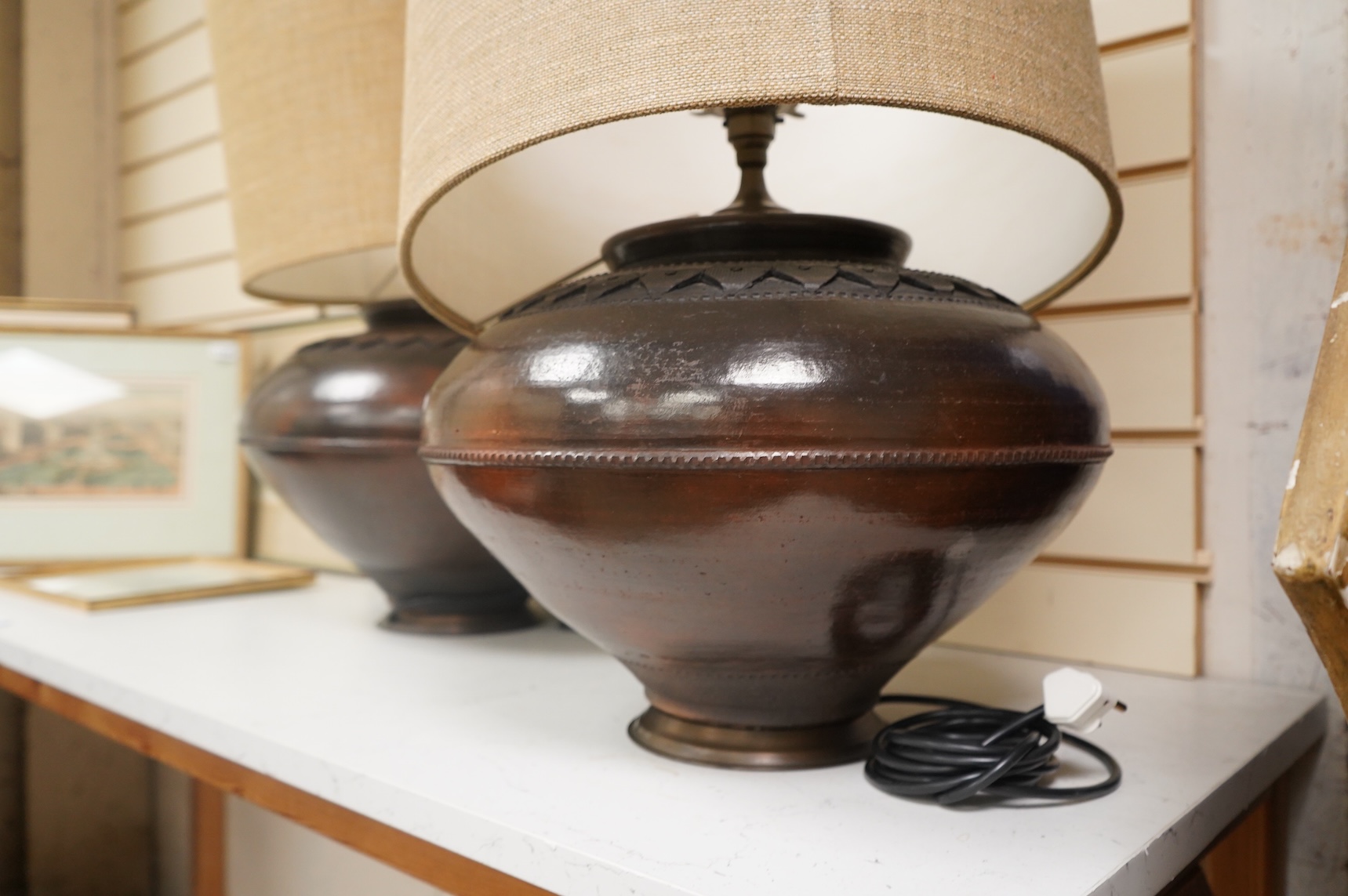 A pair of large brass table lamps and shades, 61cm high